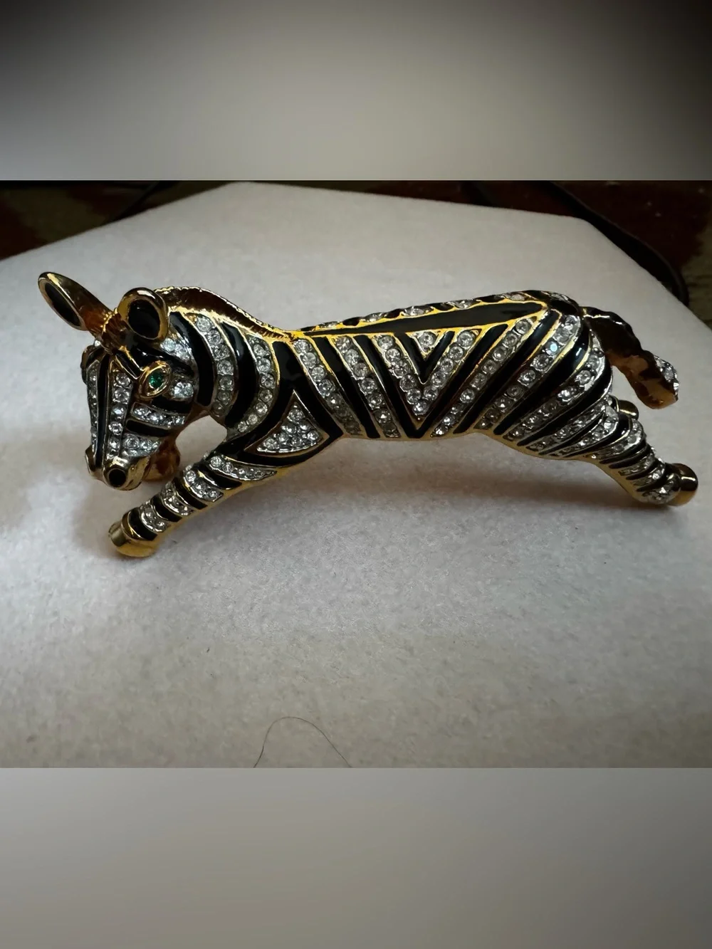 Vintage 1980s gold and black enamel over the shoulder brooch
